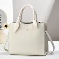 Beige lychee pattern leather tote bag with elegant silk scarf wrap on handle - Off White