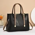 Elegante borsa tote in pelle patchwork nera e marrone con tracolla regolabile - Nero