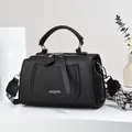 Fashion black lychee grain leather crossbody handbag with wide woven shoulder strap - Black