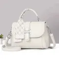 Detail of off-white lychee leather handbag with woven handle and plaid silk scarf decoration - White