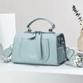 Light blue lychee pattern faux leather handbag with wide geometric fabric strap - Blue