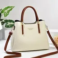 Elegant off-white lychee texture leather tote bag with brown handles and gold logo - 29x12x23cm / Off-white