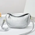 Silver crescent moon shoulder bag with lychee texture and gold-tone hardware detail - Silver