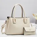 Close-up of cream crocodile-embossed handbag set with elegant golden hardware details - Creamy White Set / Off White
