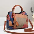 Retro patchwork faux leather handbag in blue and rust red with tassel charm - Wine Red