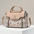 Elegant beige crossbody bag with Chinese wave embroidery and swan pearl tassel detail - L23 W11 H18 / Khaki