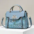 Blue Chinese vintage embroidered handbag with golden swan buckle and pearl tassels - L23 W11 H18 / Blue