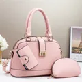 Juego de 3 bolsos rosa tipo concha con correa ajustable y textura de cuero lichi - Rosa