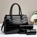 Three-piece black crocodile pattern patent leather tote bag set with wallet and pouch - Black