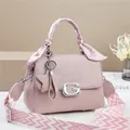 Pink lychee leather crossbody bag with G-metal buckle and floral scarf handle wrap - Pink