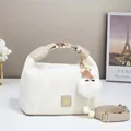 Creamy white cloud handbag with plush charm and adjustable strap for elegant style - Off White