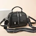 Black leather handbag with double zippers and stylish arrow pattern wide shoulder strap - Black