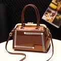 Brown gloss patent leather handbag with gold kiss-lock closure and pearl accents - Coffee