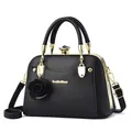 Elegante schwarze Muschel-Handtasche mit goldener Metallfassung und Kristallverschluss - Schwarz