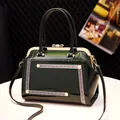 Dark green patent leather handbag with pearl accents and gold metal bow clasp - Dark Green