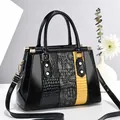 Women's handbag in black glossy patent leather with yellow animal pattern textures - Black