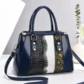 Deep blue patent leather patchwork handbag with glossy snake and croc textures - Blue