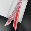 Detail of silk twilly scarf with pink floral bamboo print and red Paris logo side - Pink and Red Bamboo Style (T462-3) / 100cm