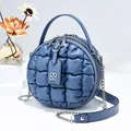 Round quilted bubble bag in morandi blue with a top handle and a metal chain strap - Blue