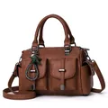 Brown faux leather Boston bag with tassel star charm and dual front flap pockets - Earthy Yellow