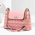 Pink quilted crossbody bag with gold chain strap and sparkling rhinestone twist lock detail - Pink