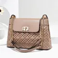 Detailed close-up of the quilted leather texture and rhinestone-studded golden lock - Khaki