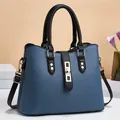Blue lychee pattern leather tote bag with black handles and gold clasp hardware - 30 x 12 x 23cm / Blue