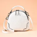 White croc-embossed dome shoulder bag for women with top handle and gunmetal zippers - White