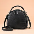 Chic black crocodile embossed handbag with white stitching and adjustable strap - Black