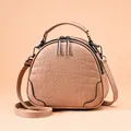 Beige faux crocodile leather crossbody bag in semi-circular design with top handles - Khaki