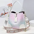Pink and blue gradient bucket bag with floral patterns and a wide fabric shoulder strap - Off-white