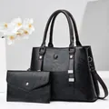 Three-piece black leather tote and envelope clutch set with contrasting brown handles - Black