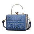 Macro view of navy blue patent leather texture with gold rivet ko ko lettering detail - One Size / Dark Blue