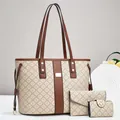 Detailed macro view of a 3-piece beige tote bag set with branded monogram and brown handles - Khaki with Brown