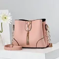 Pink Saffiano leather bucket bag with gold cat buckle and decorative long tassel - Pink