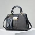 Fashionable grey lizard texture handbag set with gold hardware on display stand - Navy Blue