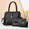 Three-piece black women's handbag set with embossed pattern and golden hardware details - Black