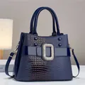 Dark blue lizard embossed handbag with glossy patent leather and crystal metal buckle - Blue