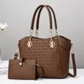 Macro shot of dark brown pebbled faux leather tote with textured embossed circular patterns - 28x12x25cm / Brown