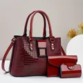Close-up of wine red crocodile texture patent leather handbag three-piece set with straps - Burgundy