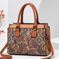 Detail of crossbody bag with cork texture and retro mandala floral print on white stand - Style 6