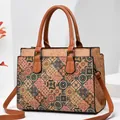 Women's crossbody bag featuring geometric ethnic prints and brown leather handles - Style 8