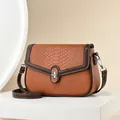 Brown crocodile pattern crossbody bag with silver twist lock on white geometric stand - Yellow Brown Contrast (AL741705386444) / Khaki/Earth Yellow