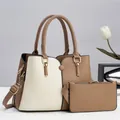 Detailed view of bicolor large tote bag set with matching pouch and gold-tone hardware - Khaki
