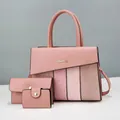 Detailed view of pink PU leather multi-piece handbag set with crocodile pattern texture - 31x13x24cm (3-Piece Set) / Pink