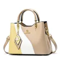 Fashionable color-block women's handbag in yellow and white with gold butterfly charm - Khaki Color Block