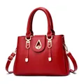 Bright red faux leather tote bag with gold hardware and a teardrop-shaped lock - 30x14x21 / Burgundy