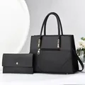 Two-piece black faux leather tote set with matching wallet and gold hardware detail - Black