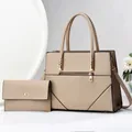 Detail of beige two-piece bag set with tote and long zipper wallet on minimalist background - Khaki