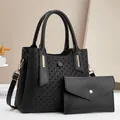 Black embossed geometric tote bag and envelope wallet set with gold hardware and leather straps - Black